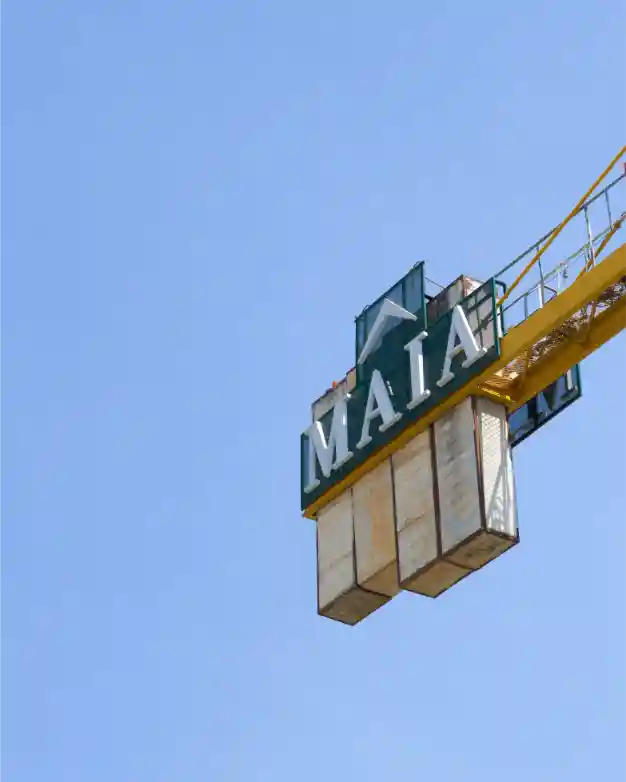 Construction crane with MAIA branding